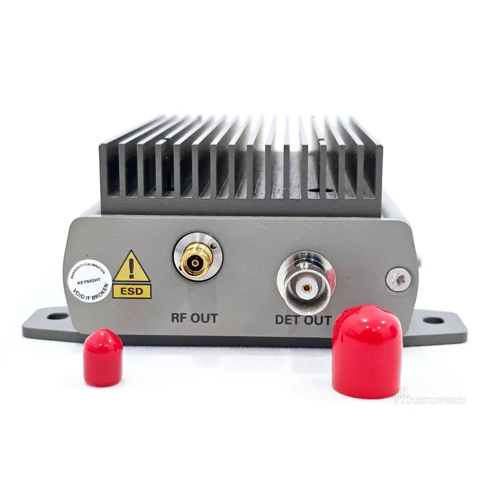 Keysight 83017A output panel showing RF OUT 3.5mm female, DET OUT BNC female, ESD warning, warranty seal