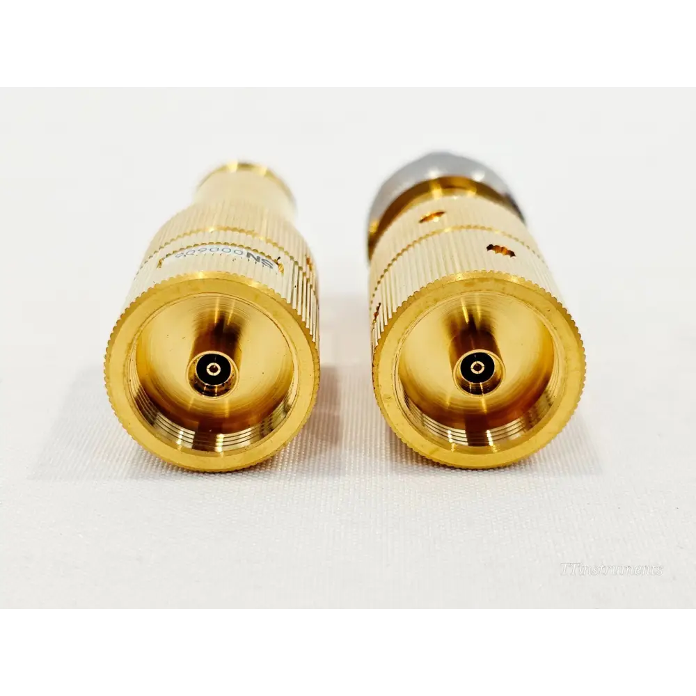 Keysight 85130C NMD 3.5mm adapters end-on view showing gold NMD female connector faces of both adapters