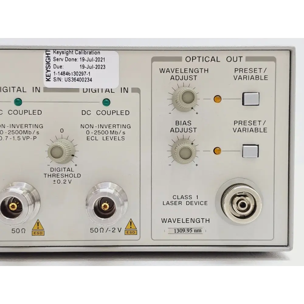 HP 83430A Lightwave Transmitter close-up of optical output section showing wavelength/bias adjust knobs, preset buttons and FC connector at 1309.95 nm