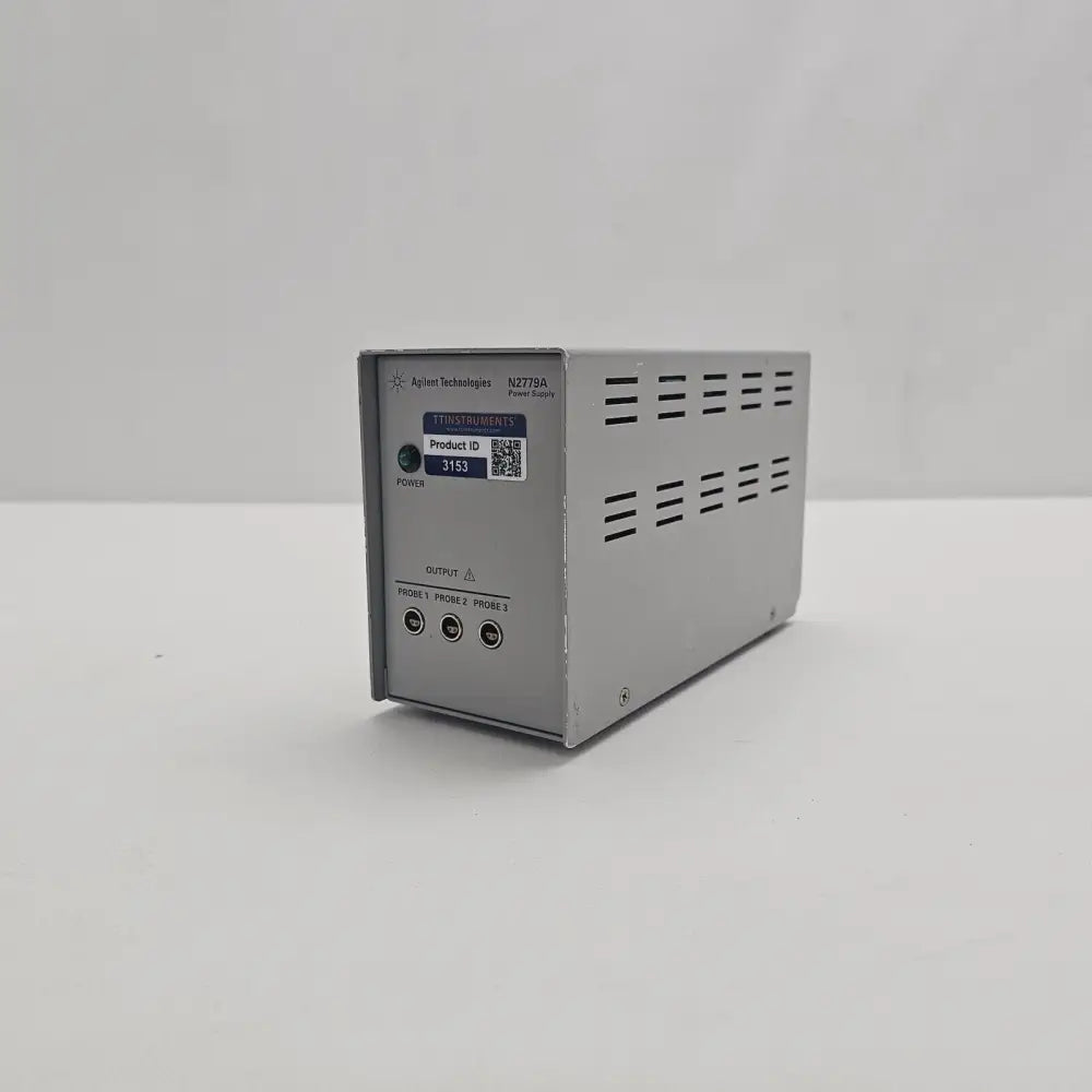 Agilent N2779A Power Supply front and right-side view showing ventilation slots and compact grey enclosure