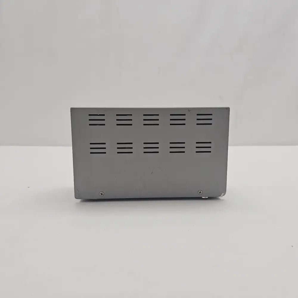 Agilent N2779A Power Supply rear ventilation panel with two fixing screws and rubber feet visible