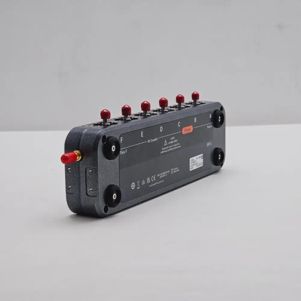 Keysight N7564A 6-port ECal Module rear-angle view showing underside label, ports B–D, 3.5 mm indicator and Thru F port