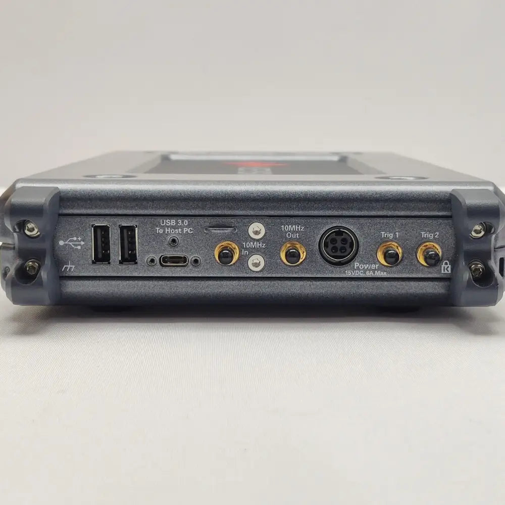 Keysight P9241A oscilloscope rear panel showing USB 3.0 host port, USB-C, 10MHz In/Out, power connector, Trig 1 and Trig 2