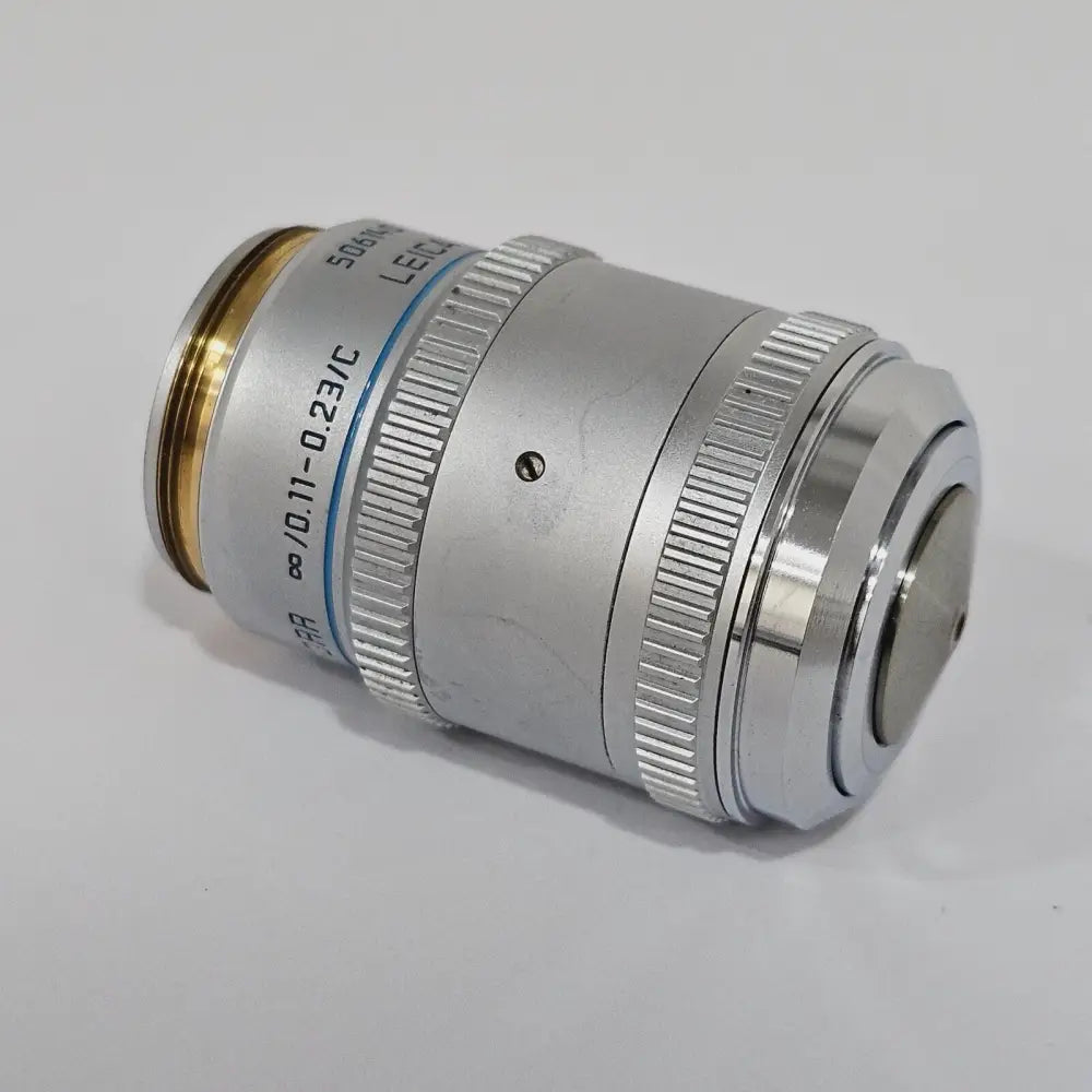 Pair of Leica HC Plan 10x/22 M eyepieces 507804 side by side, showing diopter adjustment ring and eyecup