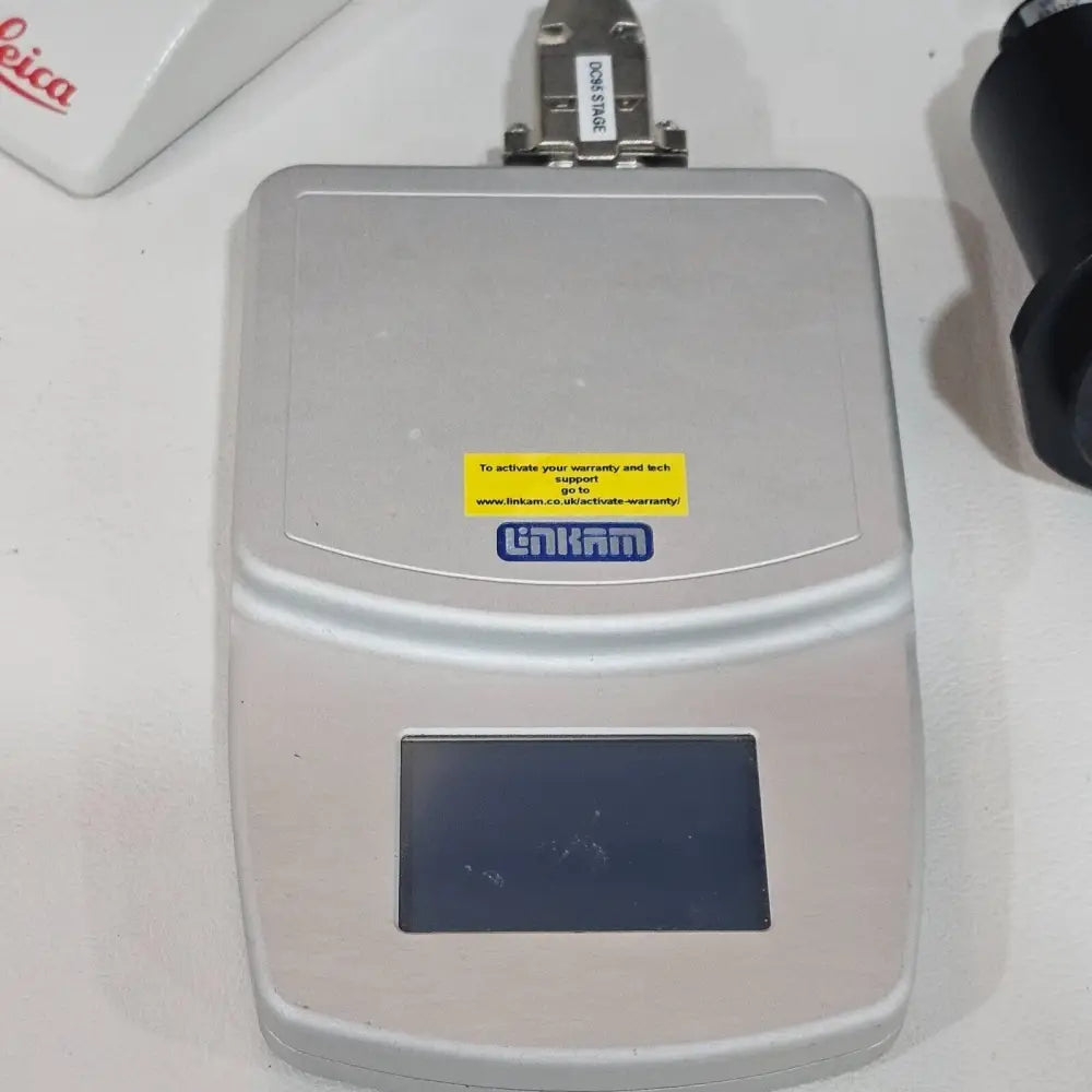 Leica DM2000 LED microscope left-side view showing condenser height adjustment and field diaphragm