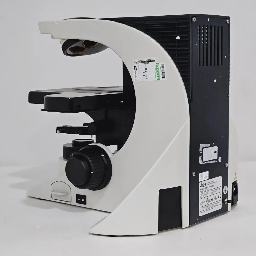 Leica DM2000 LED microscope accessories included with unit laid out beside stand