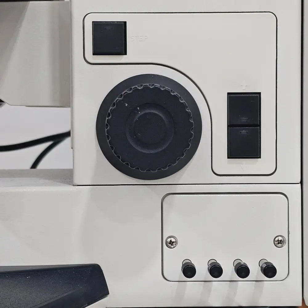 Leica DMRE HC fluorescence filter turret showing rotatable filter cube housing