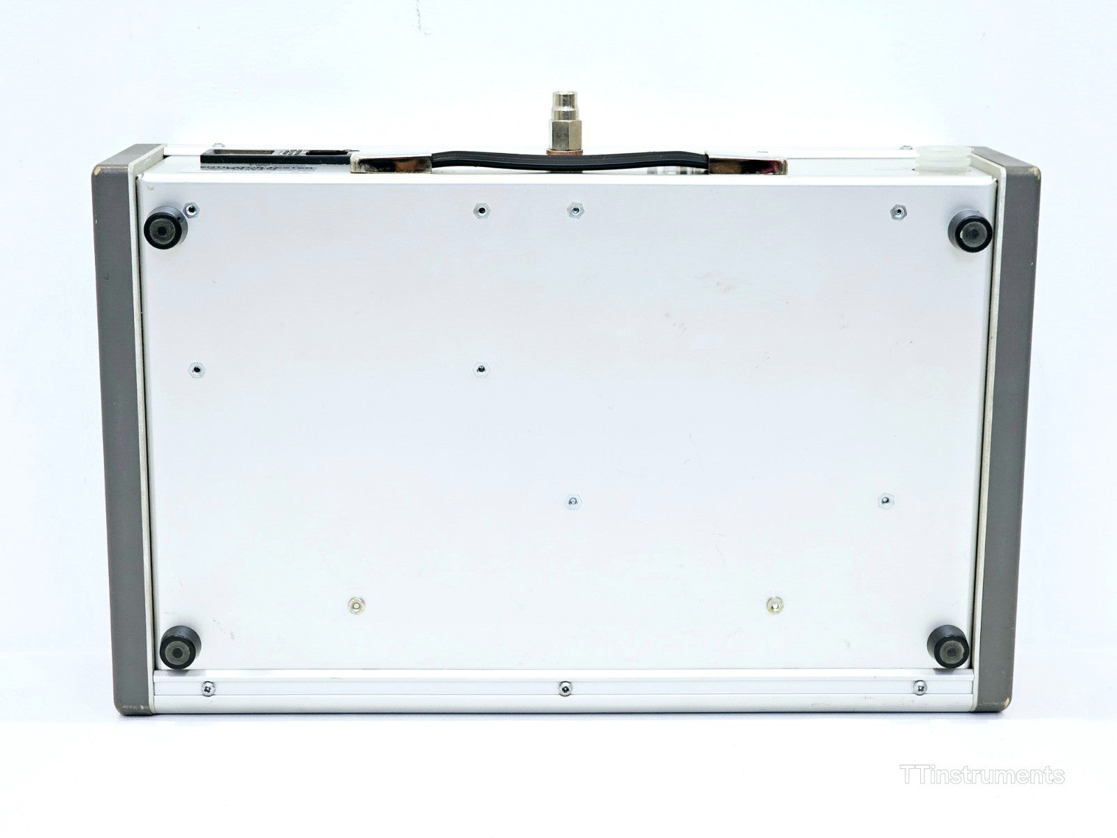 Metron QA-VTM Ventilator Tester base/underside view showing four rubber feet and carry handle