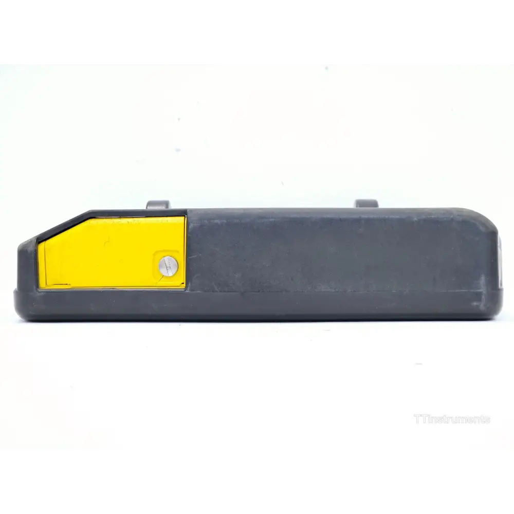 Narda SRM-3006 top edge view showing battery compartment cover with yellow accent and locking screw