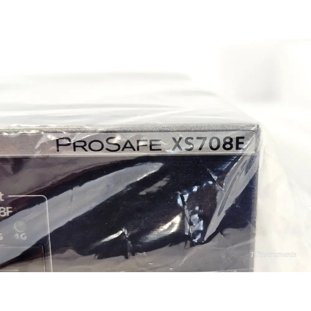Netgear ProSAFE XS708E switch chassis close-up showing ProSafe XS708E model name on front panel in anti-static wrap