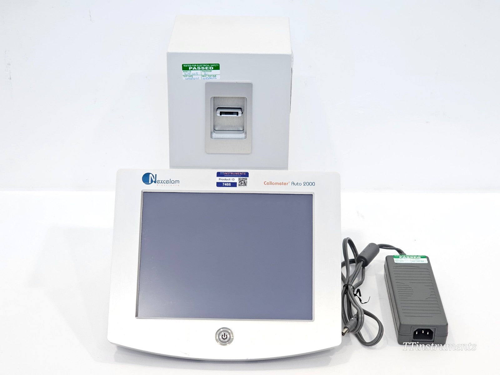 Nexcelom Cellometer Auto 2000 Cell Profiler with included 12V DC power adapter, both PAT tested and shown from front
