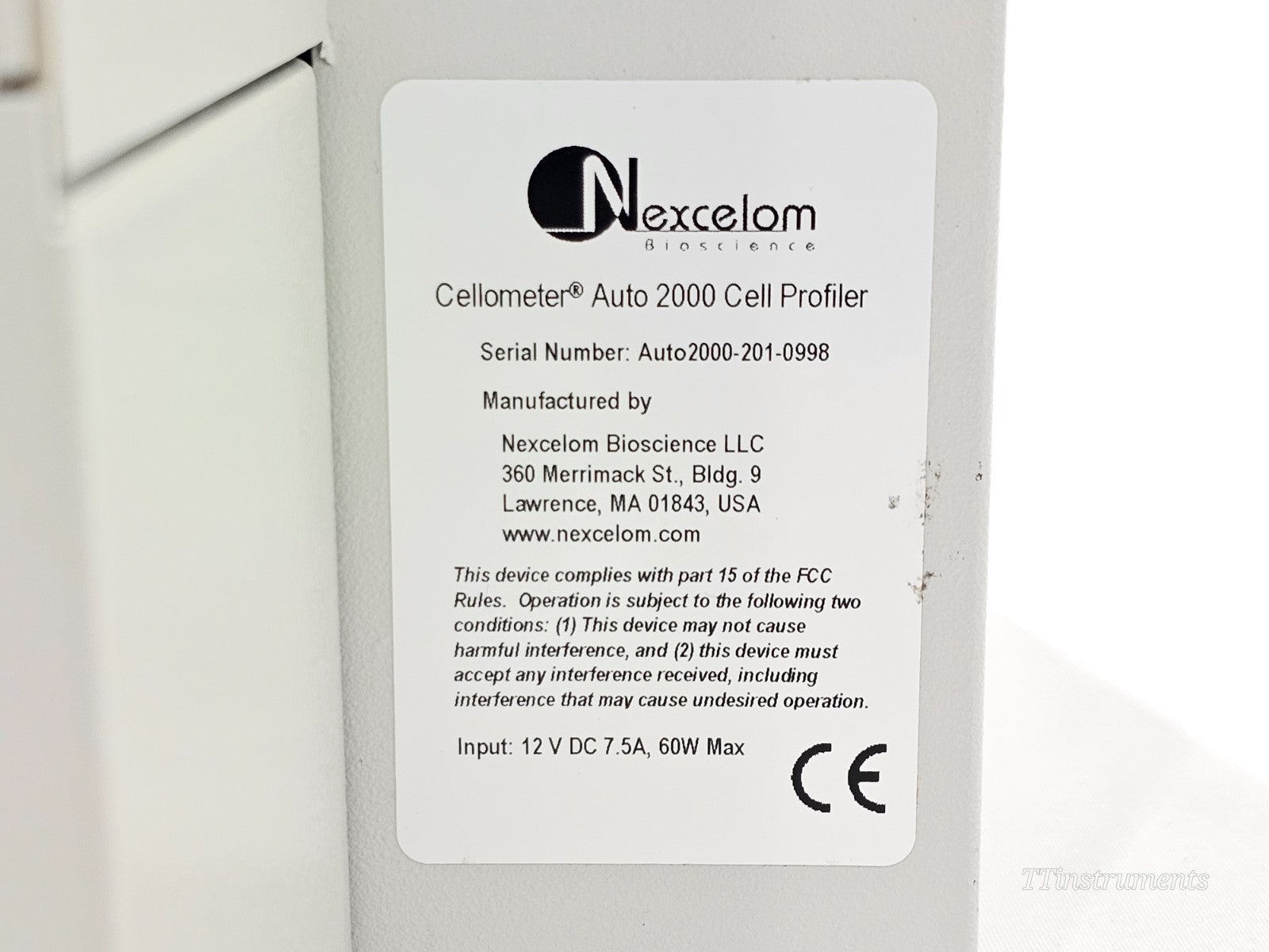 Nexcelom Cellometer Auto 2000 serial number label showing S/N Auto2000-201-0998, 12V DC 7.5A input, and CE marking