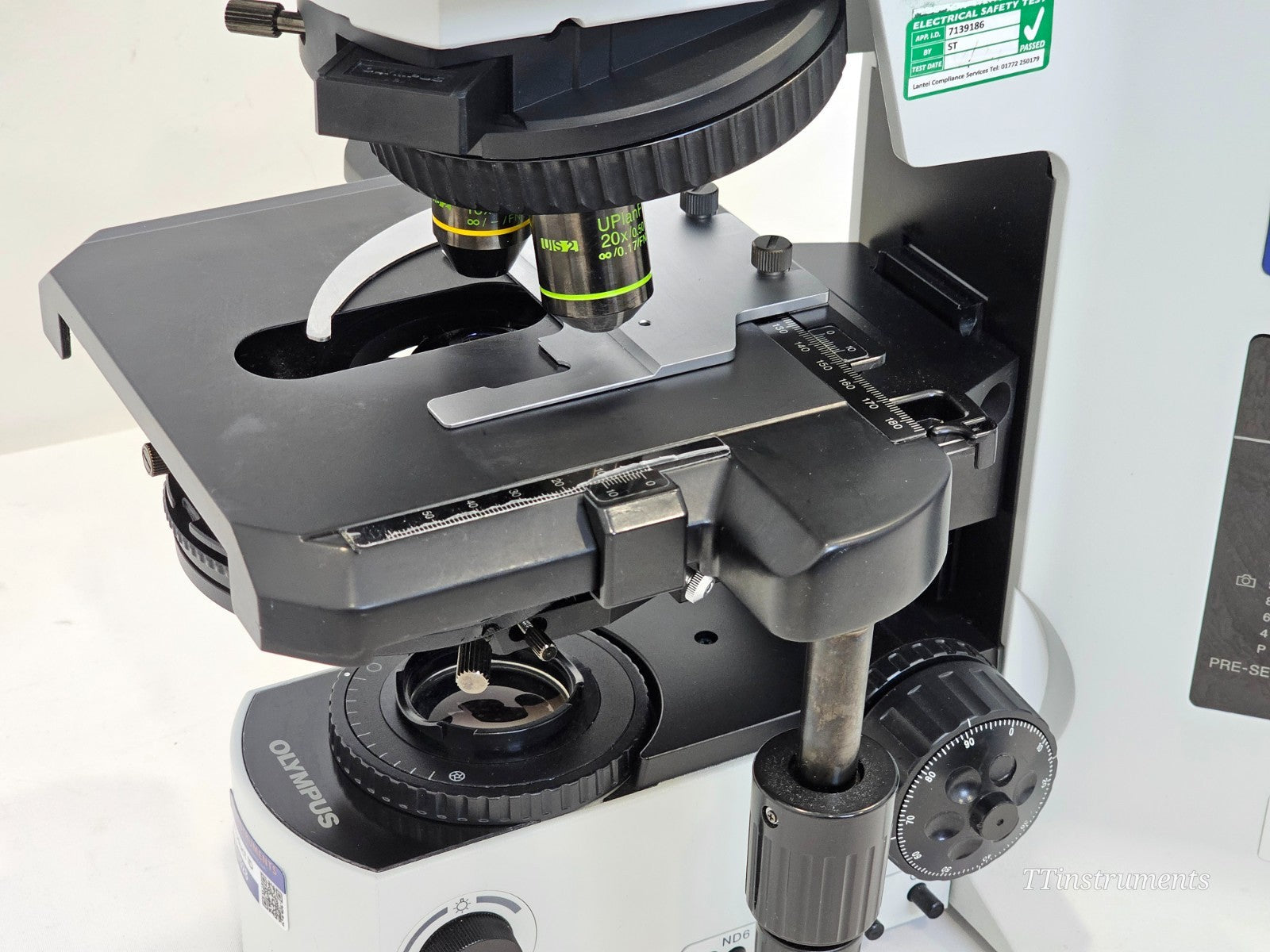 Olympus BX51TF left-side view showing coaxial coarse and fine focus knobs