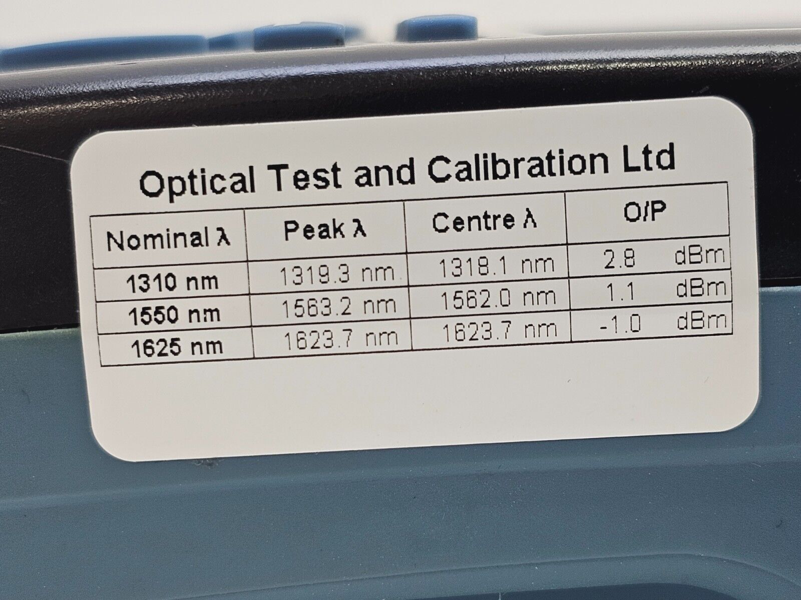 EXFO FOT-930 MaxTester II unit in hand demonstrating compact ergonomic form factor