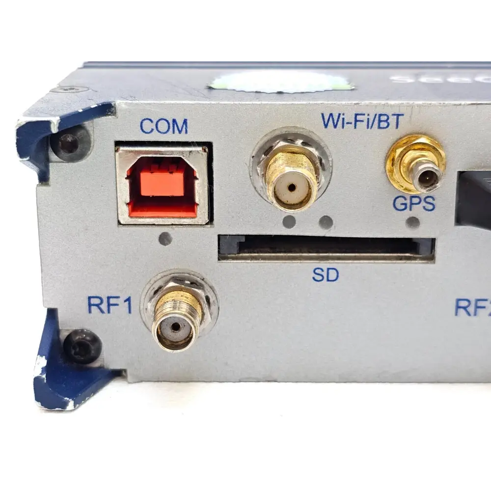 PCTEL SeeGull IBflex close-up of COM port, Wi-Fi/BT SMA, GPS SMB, SD card slot, and RF1 SMA connector