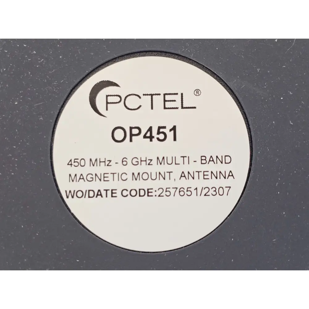 PCTEL SeeGull MX drive test scanner with GPS antenna and in-car charger on a vehicle dashboard