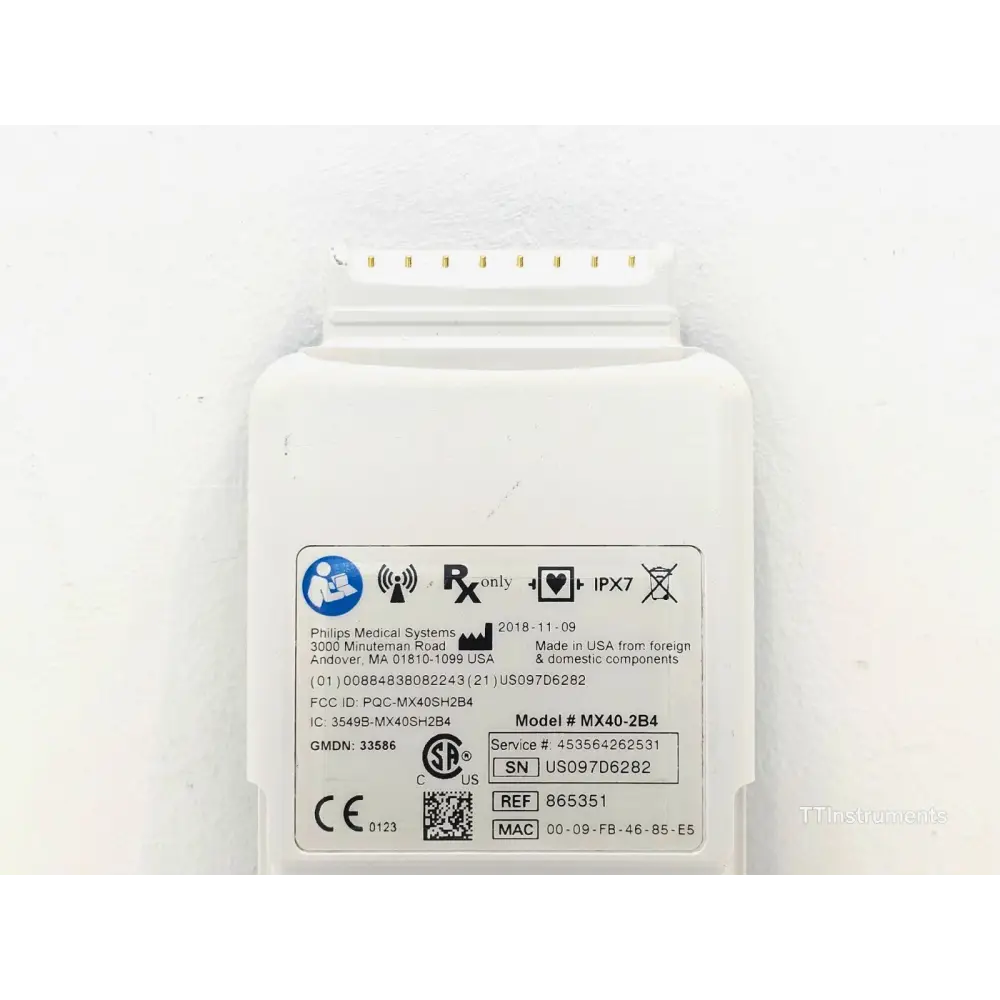 Philips IntelliVue MX40-2B4 rear label showing model MX40-2B4, SN US097D6282, REF 865351, IPX7 rating and MAC address