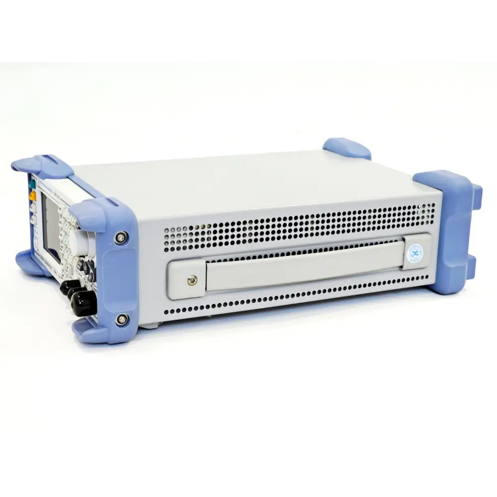 Rohde & Schwarz SMC100A right-side view showing carry handle, ventilation slots and floppy-style bay cover