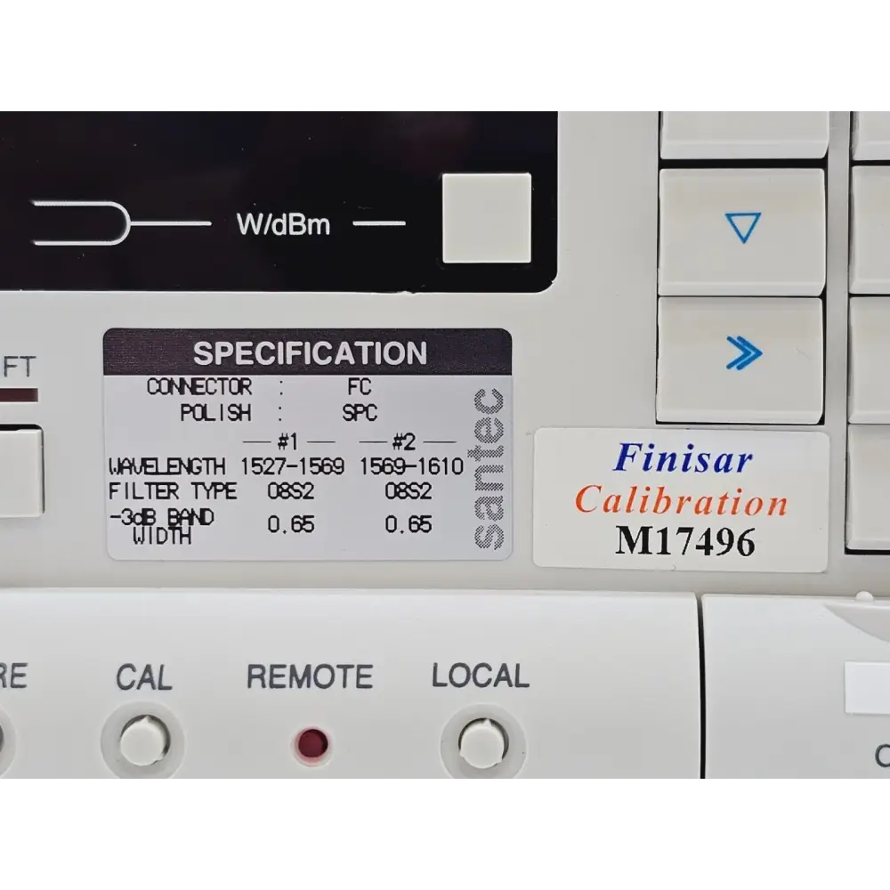 Santec OTF-930 front-panel specification label showing FC/SPC connectors, dual-band 1527–1610 nm, 08S2 filter type, 0.65 nm bandwidth, and Finisar Calibration M17496