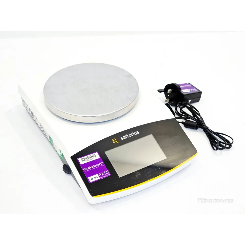 Sartorius SECURA6101-1CEU precision balance front 3/4 view with stainless steel pan and UK AC power adapter