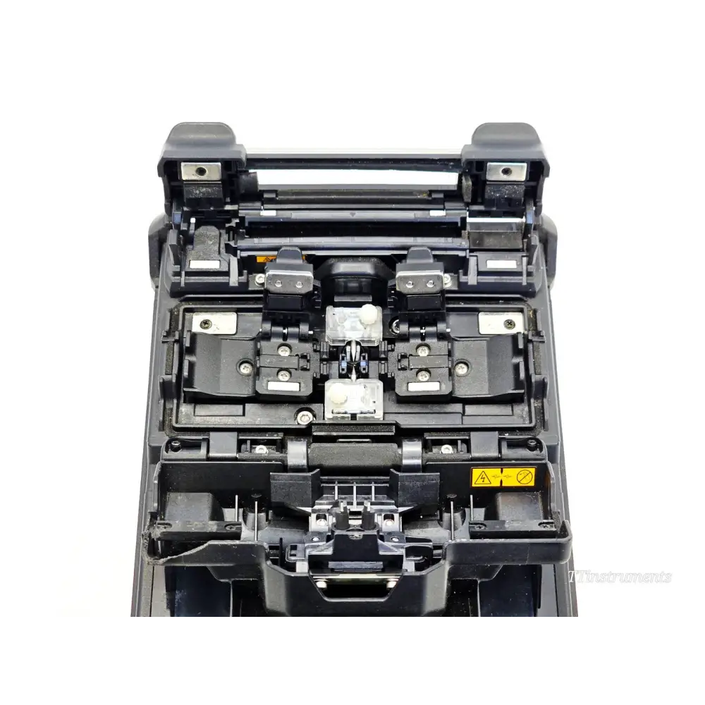 Fujikura 41S fusion splicer top-down view showing V-groove alignment mechanism, electrodes and fibre clamps open