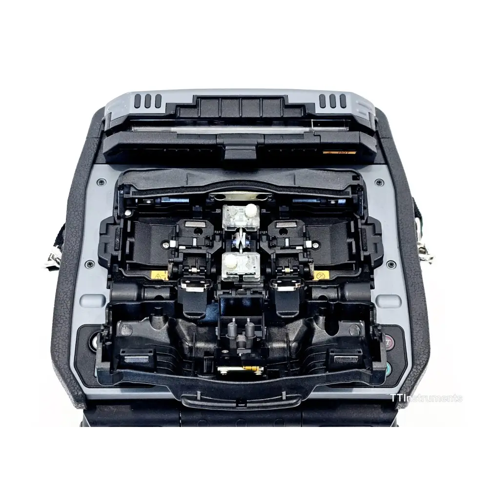 Fujikura 90S+ fusion splicer side view showing compact field-ready design and USB interfaces
