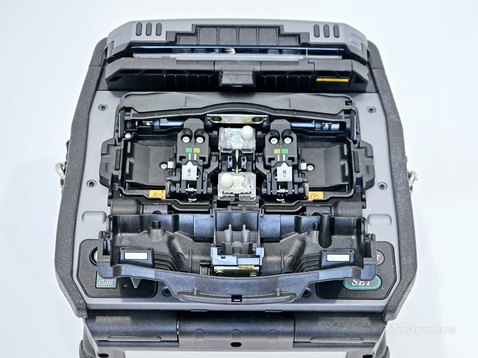 Fujikura 90S+ rear panel showing USB and power connections with BTR-15 battery installed
