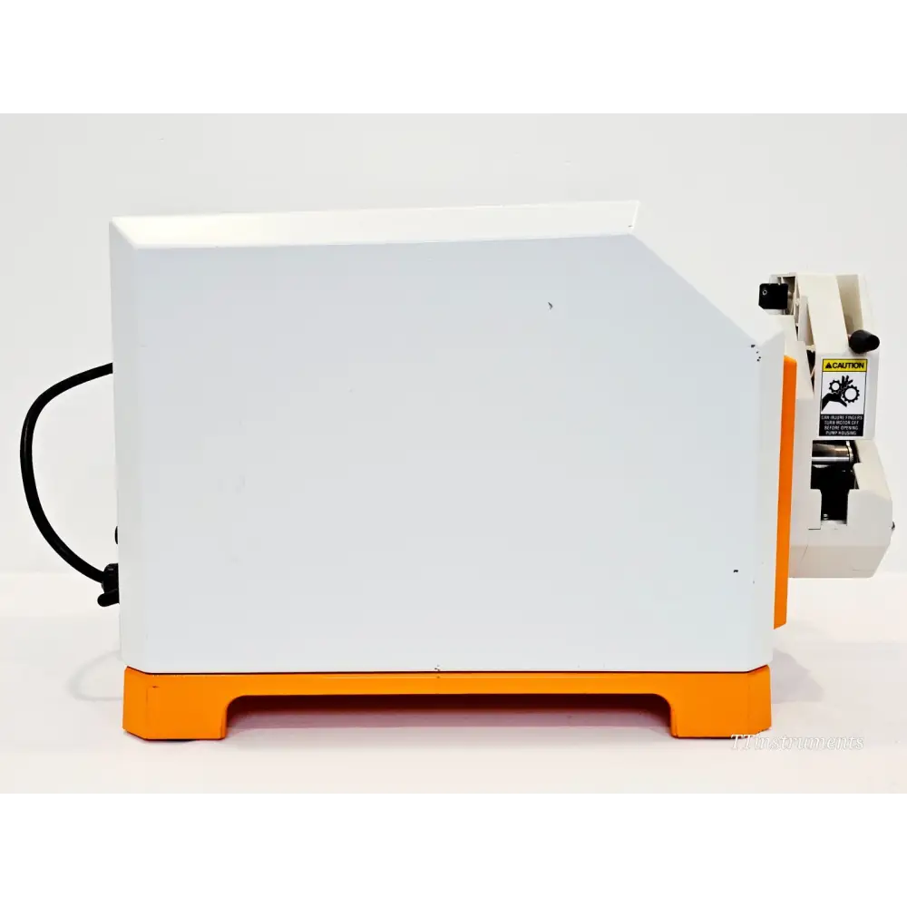 Spectrum Labs KrosFlo MiniKros Pilot 900-1939 — left side view showing white and orange housing with power cable