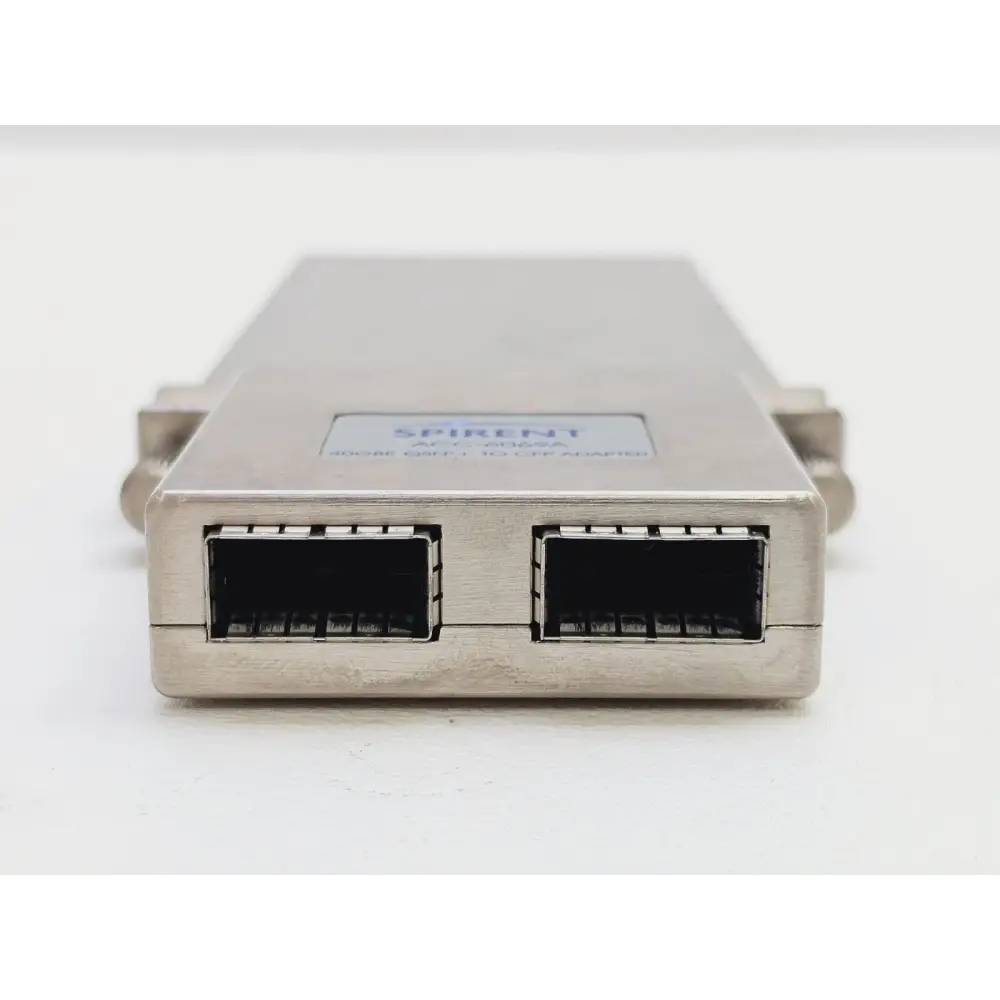 Spirent ACC-6069A 40GBE adapter front-on view showing dual open QSFP+ port cages and Spirent label