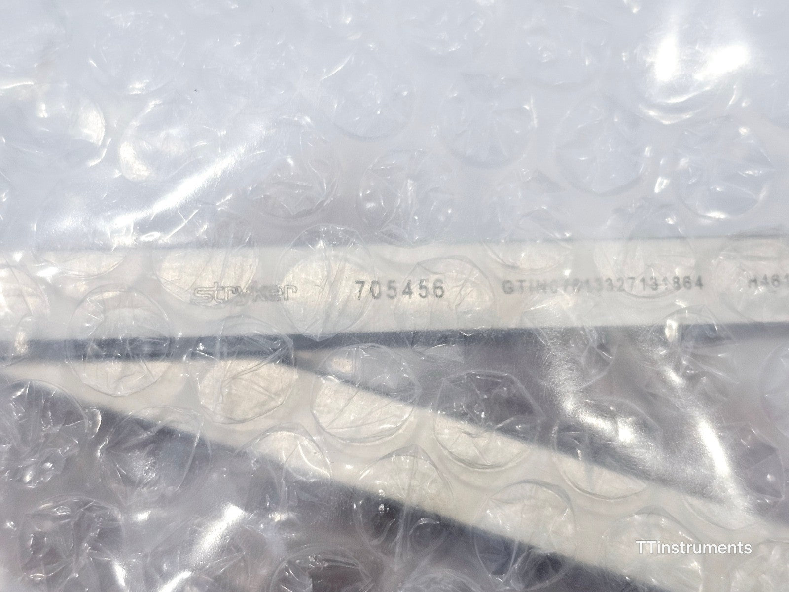 Stryker 705456 Weber Clamp side profile view with part number label visible