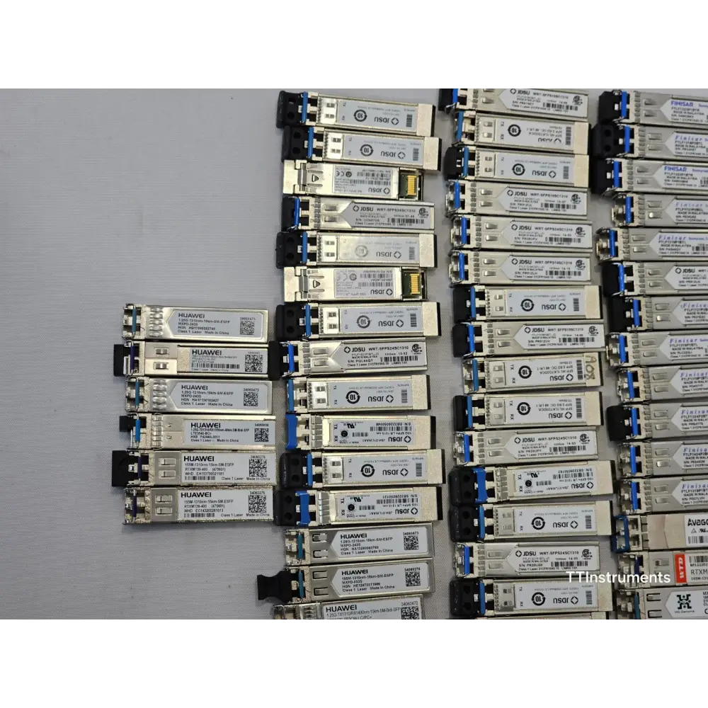 Detail view of individual optical transceiver modules from Finisar, JDSU, and Huawei in the lot
