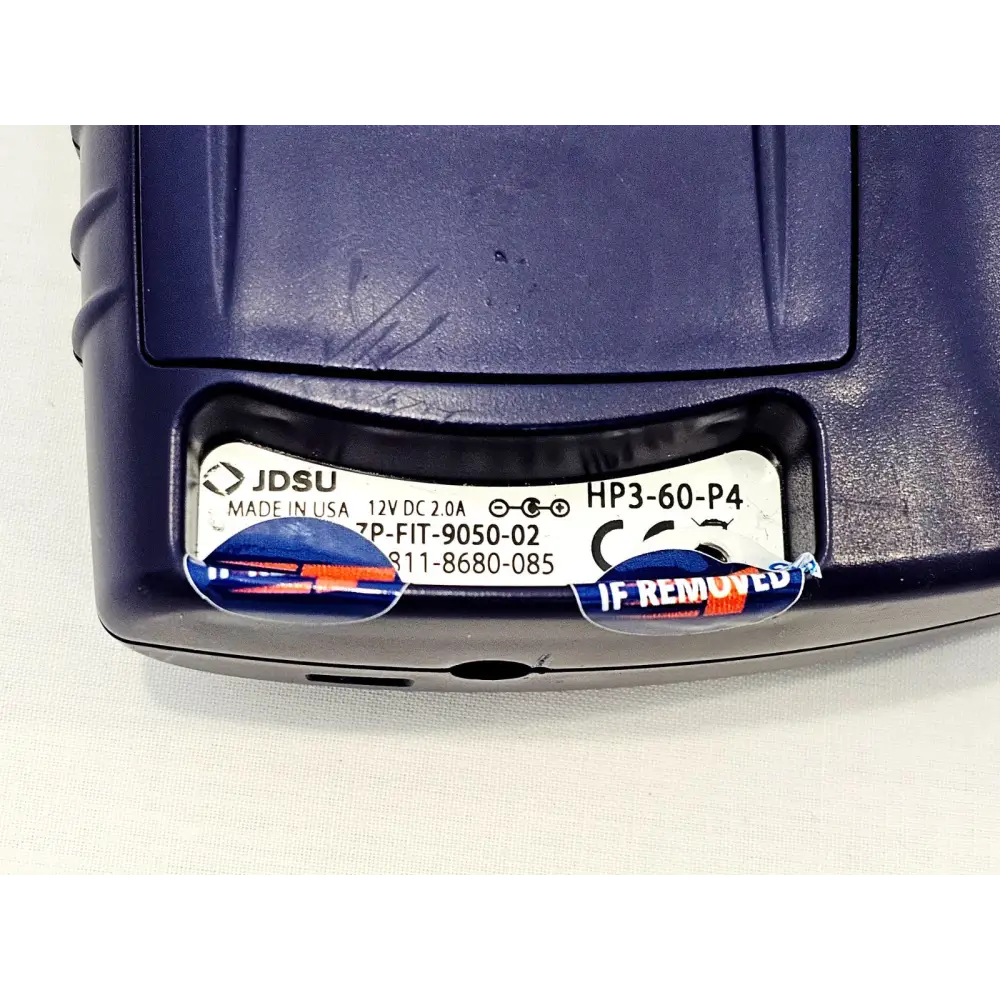 JDSU HP3-60-P4 serial label close-up showing model HP3-60-P4, 12V DC 2.0A rating, CE mark and void security seals