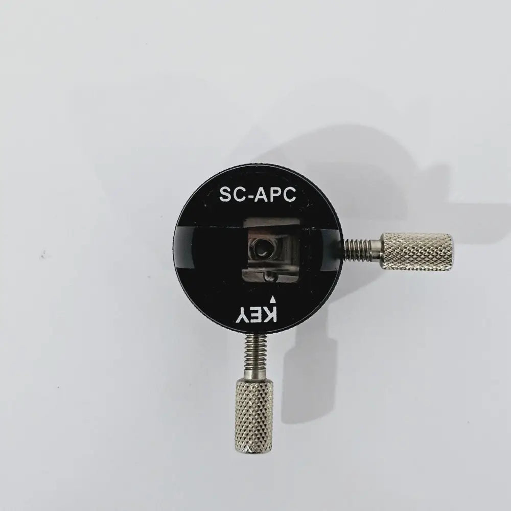 Viavi FMA-SC-APC SC/APC adapter front face view showing SC-APC port, KEY alignment marker and two knurled locking screws