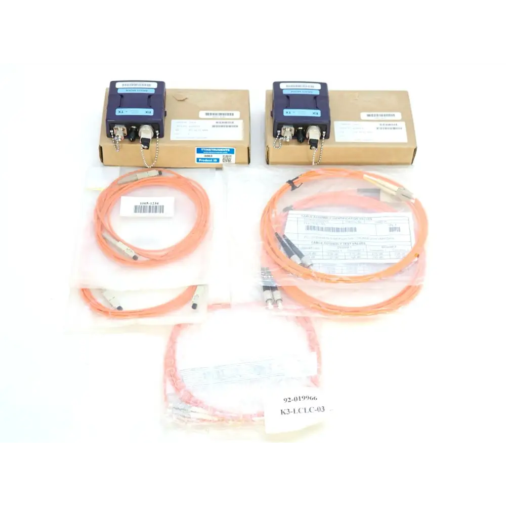 Viavi NGC_AD_EF_MM1 multimode fiber adapter kit — two units in boxes with orange reference cables laid out