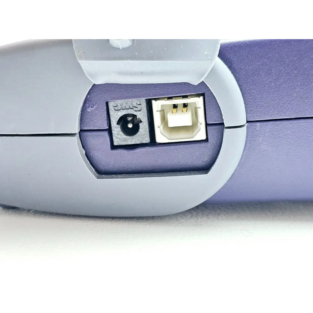 Close-up of JDSU OLT-55 SmartClass OLTS side port panel showing 5V DC power socket and USB-B connector
