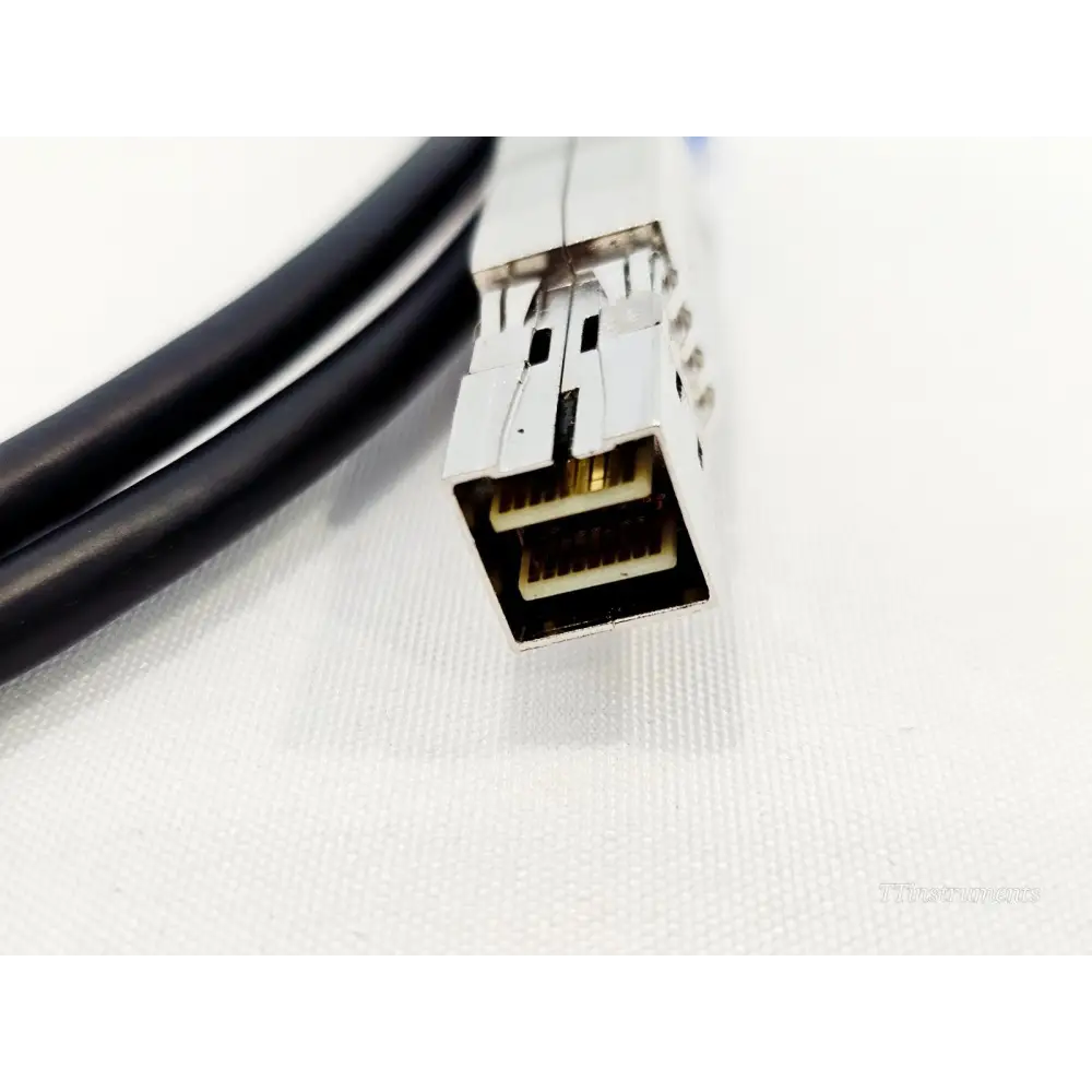 Close-up of CXP Mini-SAS HD cable connector end showing dual-row gold contacts for VIAVI Xgig PCIe Gen3 interposer