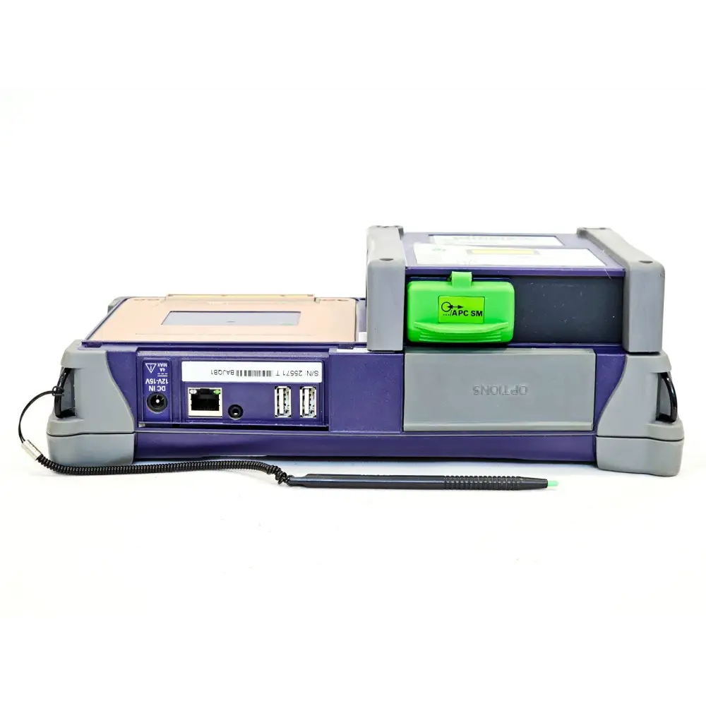 Viavi MTS 4000 bottom edge showing DC IN port, Ethernet port, two USB ports, APC SM green connector cap on 4126 LM OTDR module and stylus