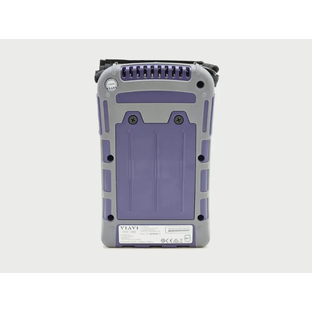 Viavi NSC-100 rear panel showing model label, serial number, regulatory markings and battery compartment screws
