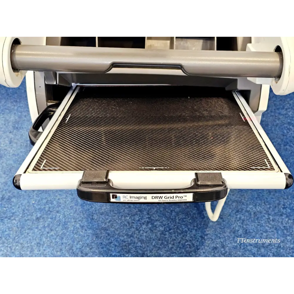 RC Imaging DRW Grid Pro detector tray pulled out from Carestream DRX-Revolution showing carbon fibre panel and handle label