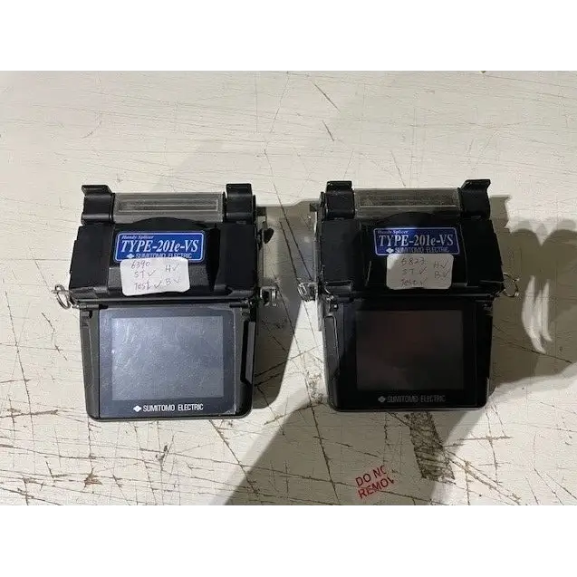 Sumitomo Type-201e-VS fixed V-groove fusion splicer front view with battery and power adapter