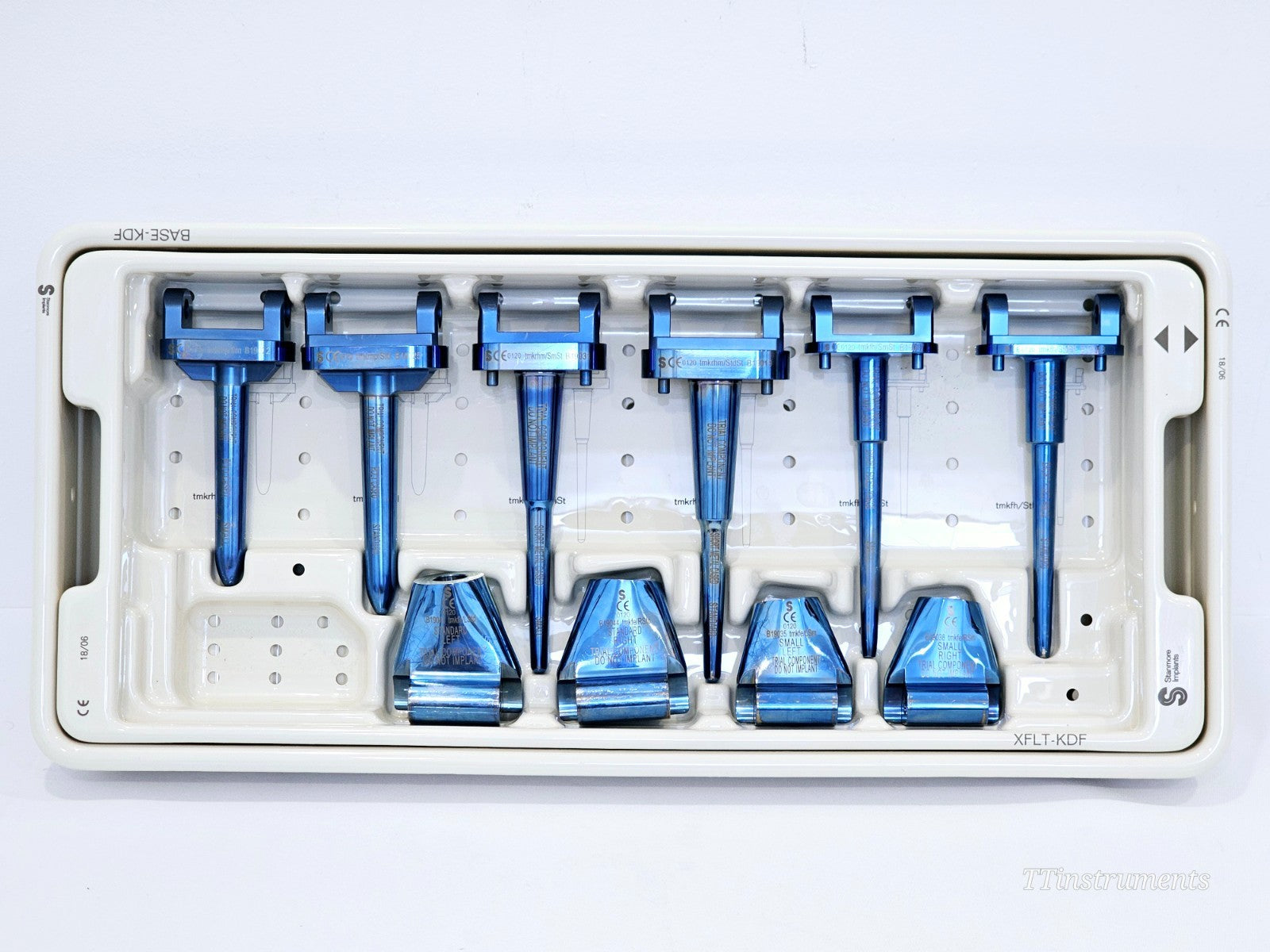 Stanmore METS XFLT-KDF upper tray showing 6 anodised blue trial stem handles and 4 trial femoral body components