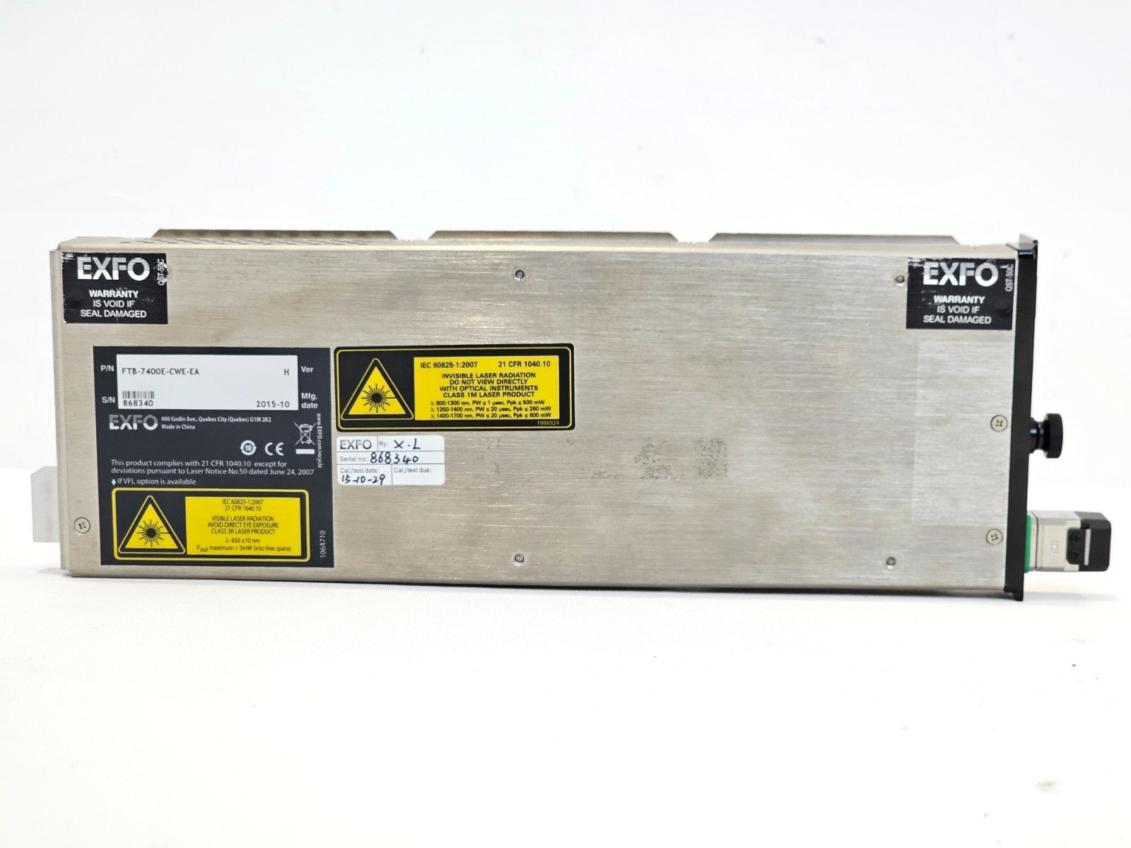 EXFO FTB-7400E-CWE rear label showing P/N FTB-7400E-CWE-EA, S/N 868340, Mfg date 2015-10, calibration sticker