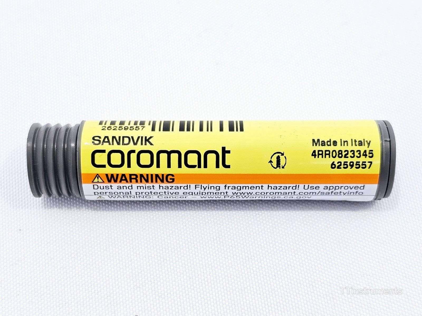 Sandvik Coromant CoroMill Plura grey storage tube reverse side showing safety warning label and serial number 4RR0823345