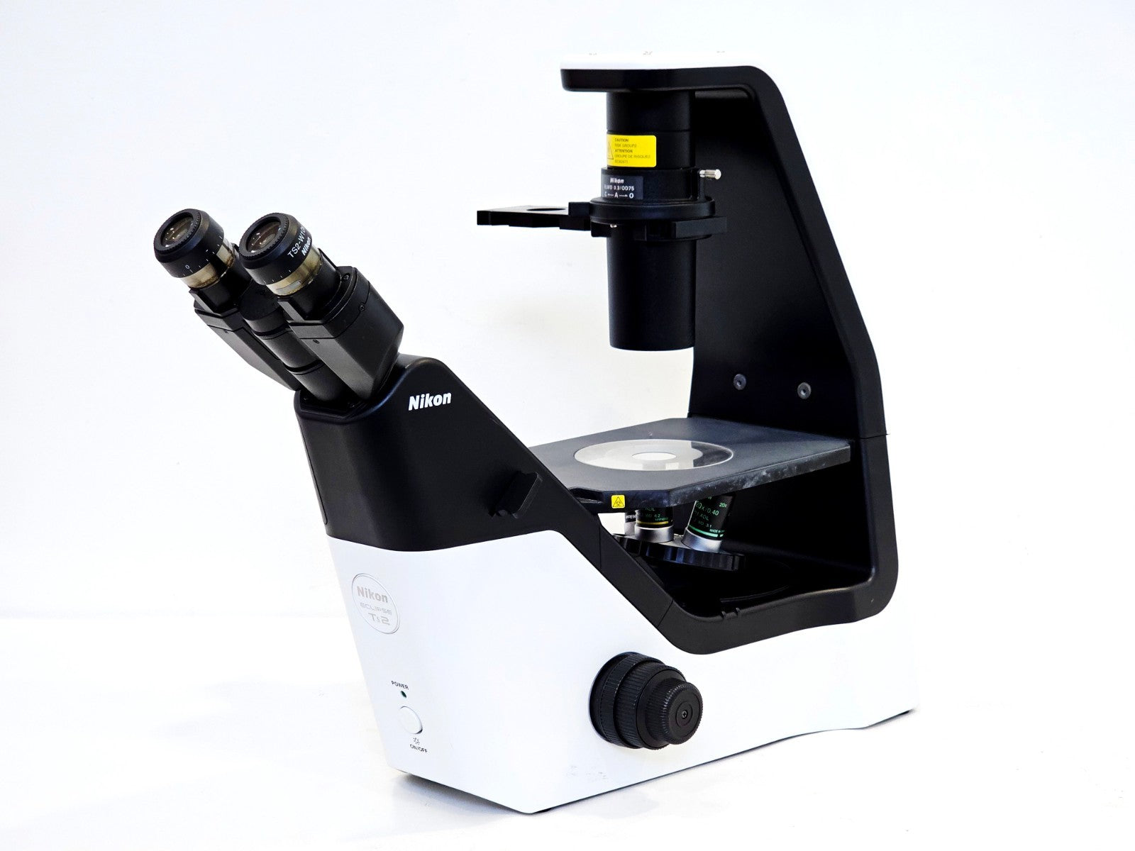 Nikon Eclipse microscope objective nosepiece and stage close-up