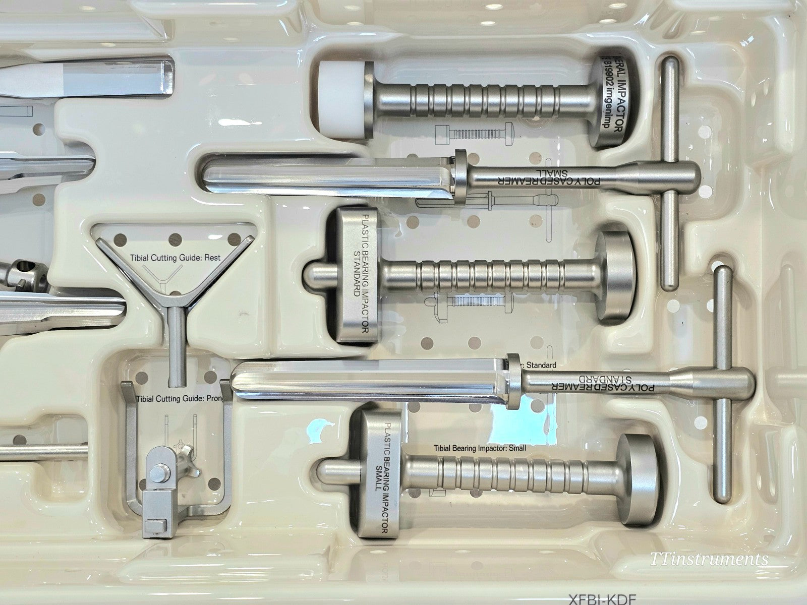 Stanmore distal femoral trial components laid out in orthopaedic instrument tray