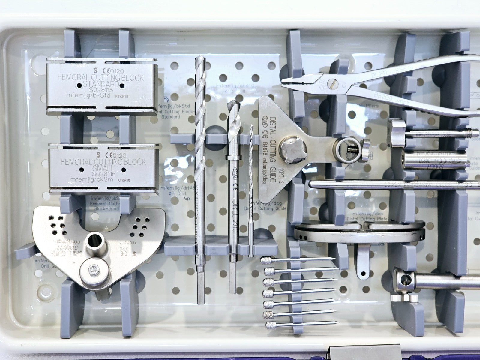 Distal cutting guide and drill guide plate components from Stanmore METS Smiles knee set