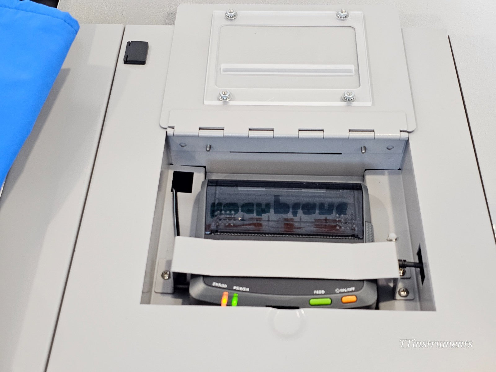 Thermo Scientific CryoMed TSCM34PV integrated thermal printer compartment open showing ERROR, POWER, FEED and ON/OFF indicator lights