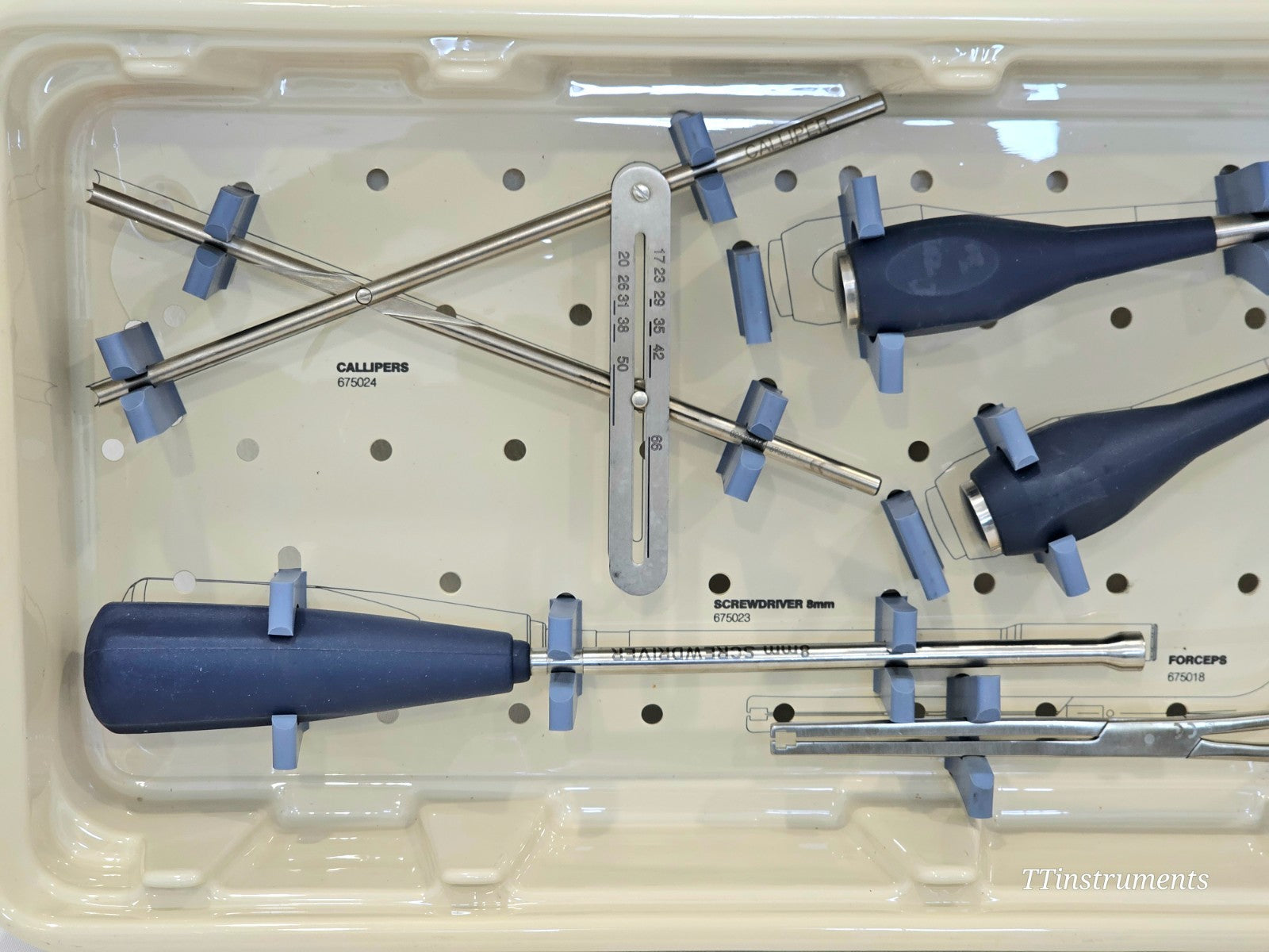 Stryker Spine MAC Tray 4801-0000 instrument tray overhead view with calipers 675024 screwdriver 675023 and forceps 675018 in holders