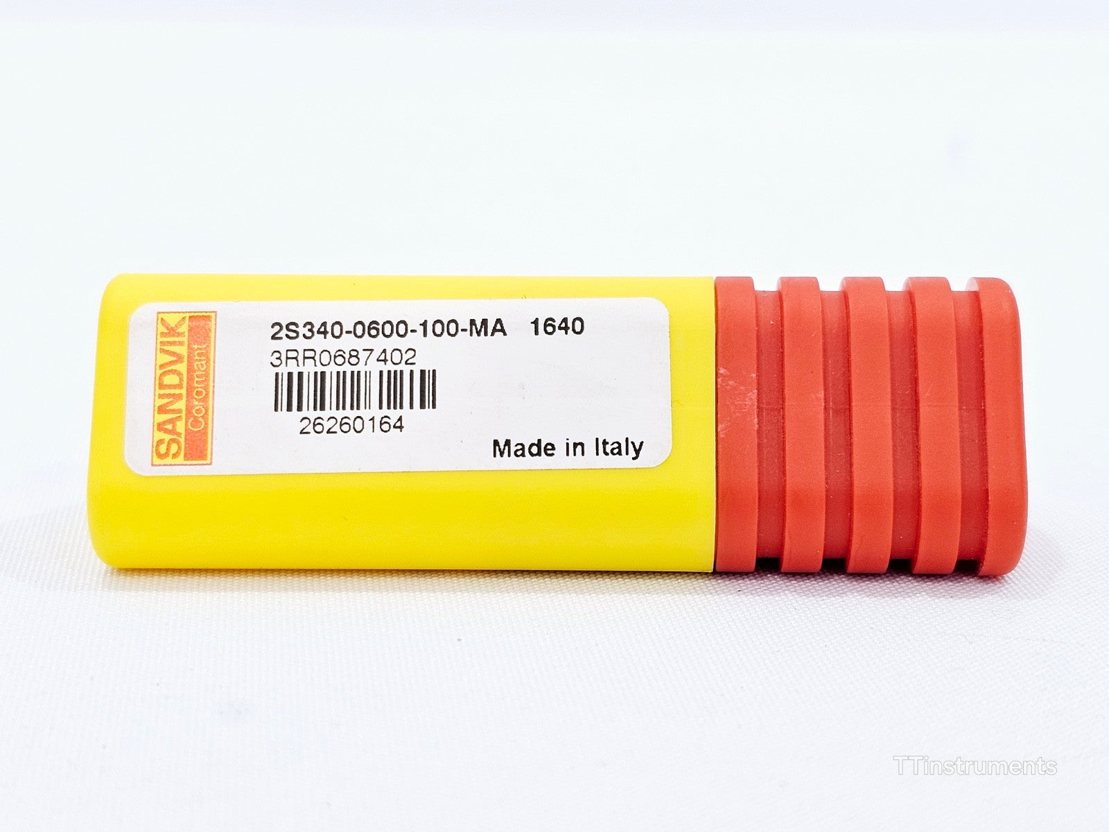 Close-up of Sandvik Coromant 2S340-0600-100-MA 1640 yellow storage tube label showing part number and Made in Italy