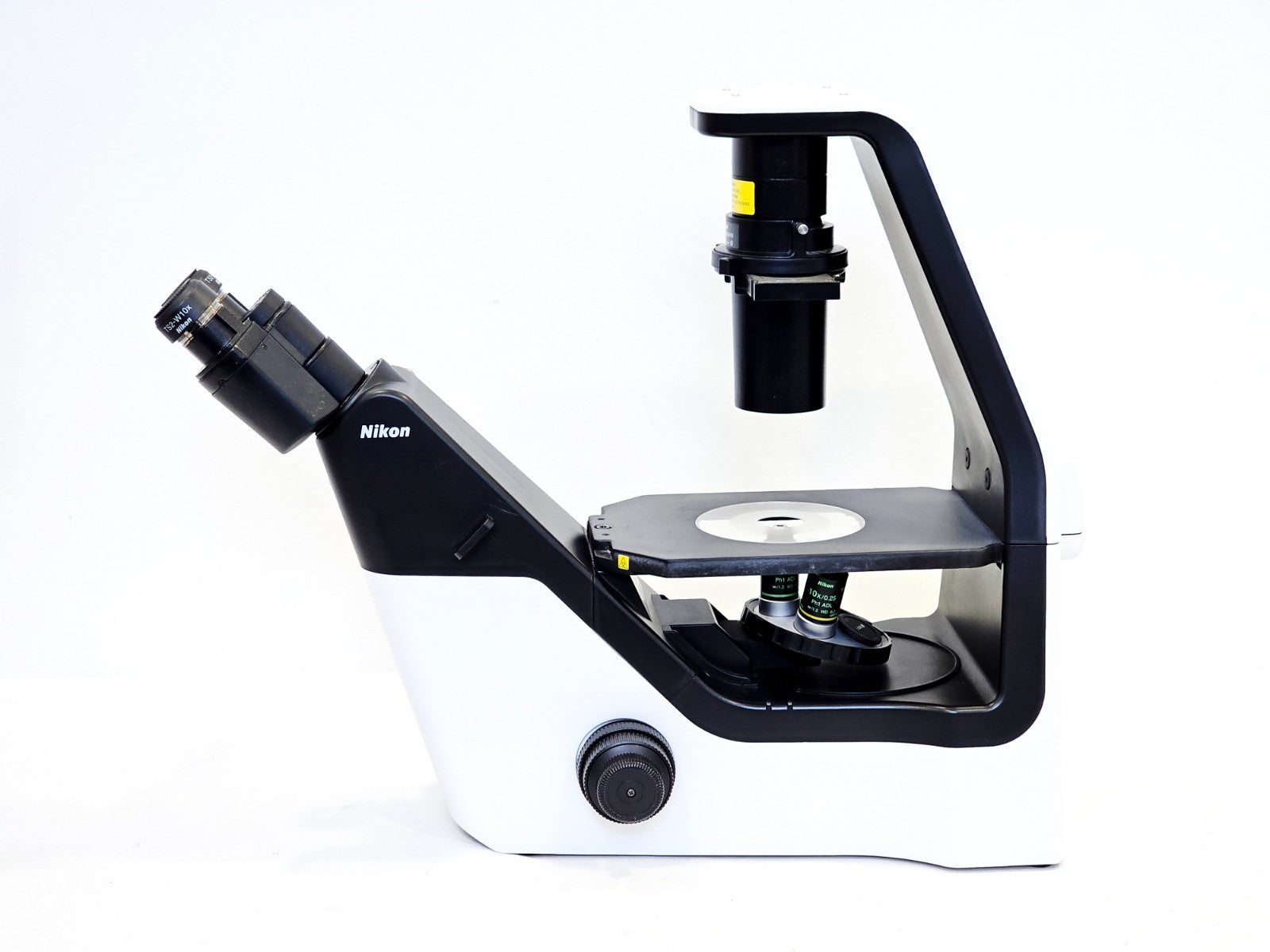 Nikon Eclipse microscope side profile view showing focus knobs and stage